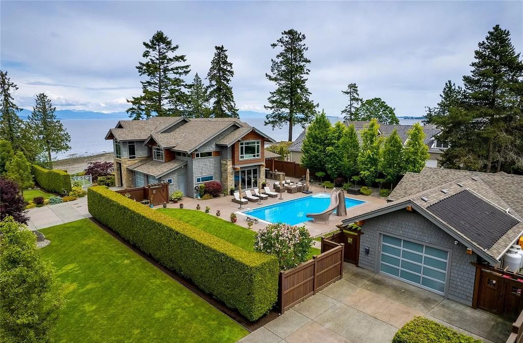 The Home in Parksville is majestically set on 0.64 of an acre with a private path that leads to the beach living space below, now available for sale. This home located at 798 Fairwind Ave, Parksville, BC V9P 1B2, Canada