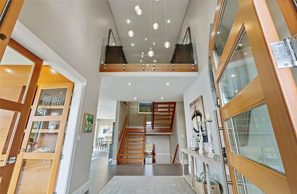The Home in Parksville is majestically set on 0.64 of an acre with a private path that leads to the beach living space below, now available for sale. This home located at 798 Fairwind Ave, Parksville, BC V9P 1B2, Canada