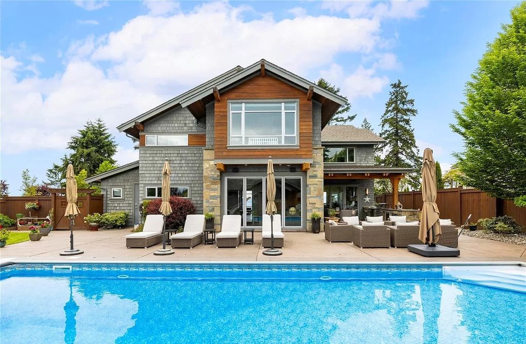 The Home in Parksville is majestically set on 0.64 of an acre with a private path that leads to the beach living space below, now available for sale. This home located at 798 Fairwind Ave, Parksville, BC V9P 1B2, Canada