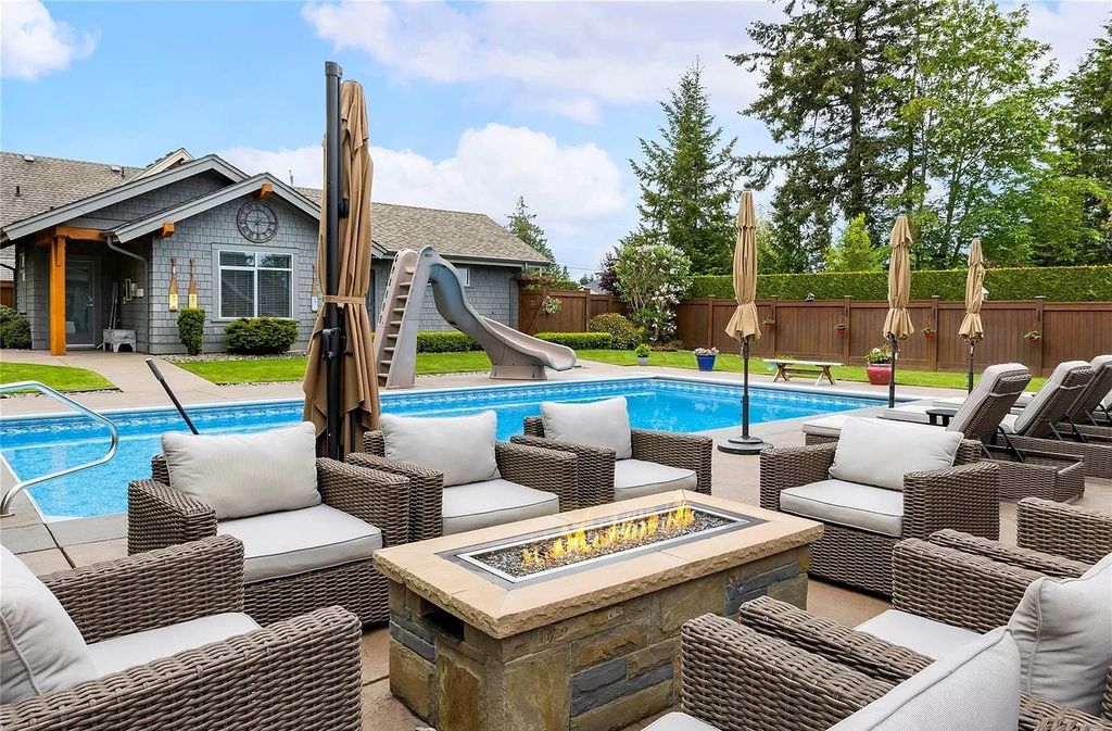 The Home in Parksville is majestically set on 0.64 of an acre with a private path that leads to the beach living space below, now available for sale. This home located at 798 Fairwind Ave, Parksville, BC V9P 1B2, Canada
