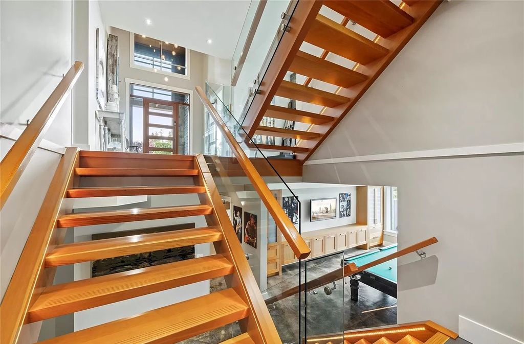 The Home in Parksville is majestically set on 0.64 of an acre with a private path that leads to the beach living space below, now available for sale. This home located at 798 Fairwind Ave, Parksville, BC V9P 1B2, Canada