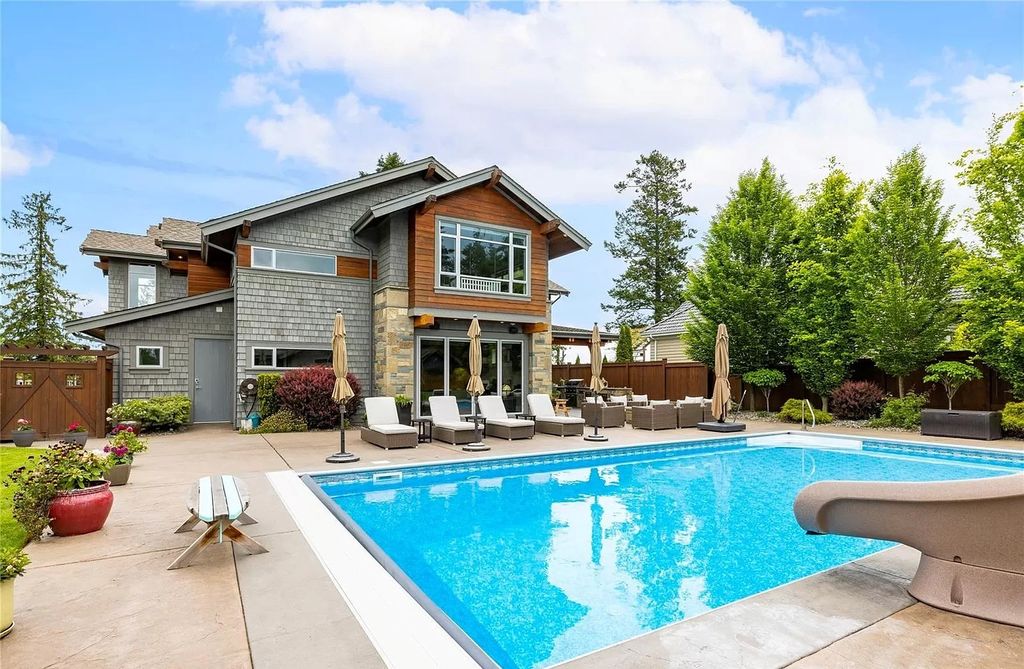 The Home in Parksville is majestically set on 0.64 of an acre with a private path that leads to the beach living space below, now available for sale. This home located at 798 Fairwind Ave, Parksville, BC V9P 1B2, Canada