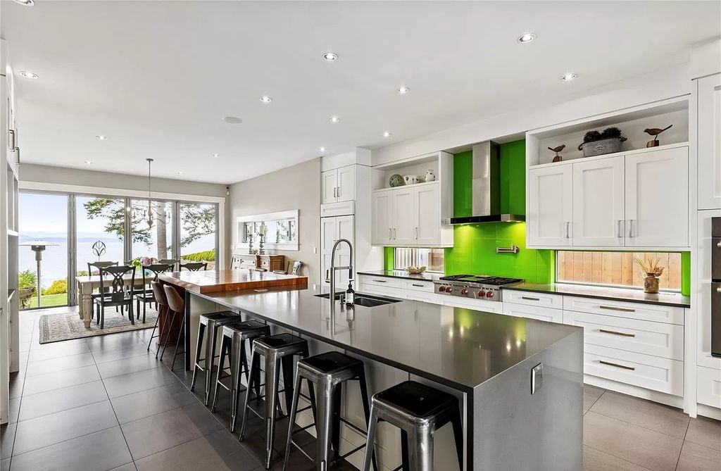 The Home in Parksville is majestically set on 0.64 of an acre with a private path that leads to the beach living space below, now available for sale. This home located at 798 Fairwind Ave, Parksville, BC V9P 1B2, Canada