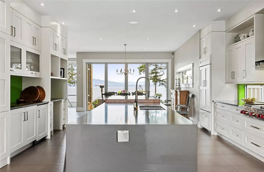 The Home in Parksville is majestically set on 0.64 of an acre with a private path that leads to the beach living space below, now available for sale. This home located at 798 Fairwind Ave, Parksville, BC V9P 1B2, Canada