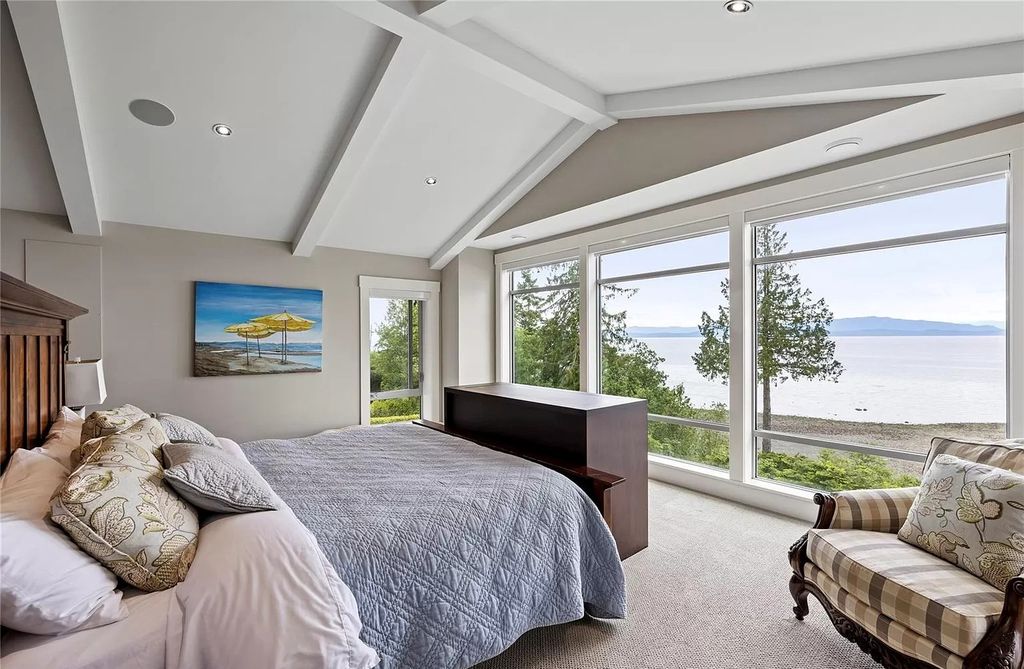 The Home in Parksville is majestically set on 0.64 of an acre with a private path that leads to the beach living space below, now available for sale. This home located at 798 Fairwind Ave, Parksville, BC V9P 1B2, Canada