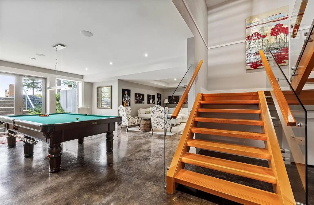 The Home in Parksville is majestically set on 0.64 of an acre with a private path that leads to the beach living space below, now available for sale. This home located at 798 Fairwind Ave, Parksville, BC V9P 1B2, Canada