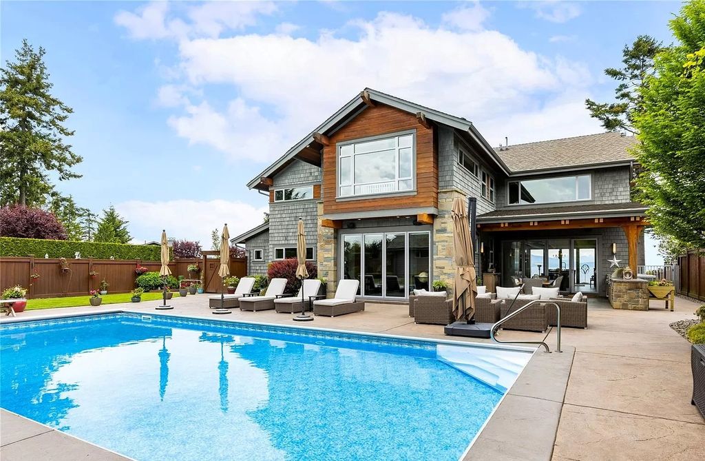 The Home in Parksville is majestically set on 0.64 of an acre with a private path that leads to the beach living space below, now available for sale. This home located at 798 Fairwind Ave, Parksville, BC V9P 1B2, Canada