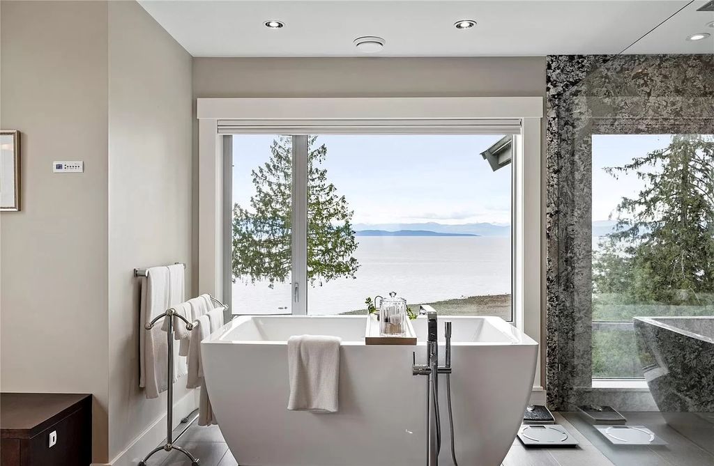 The Home in Parksville is majestically set on 0.64 of an acre with a private path that leads to the beach living space below, now available for sale. This home located at 798 Fairwind Ave, Parksville, BC V9P 1B2, Canada