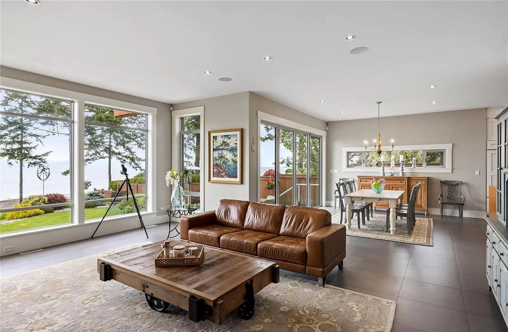 The Home in Parksville is majestically set on 0.64 of an acre with a private path that leads to the beach living space below, now available for sale. This home located at 798 Fairwind Ave, Parksville, BC V9P 1B2, Canada