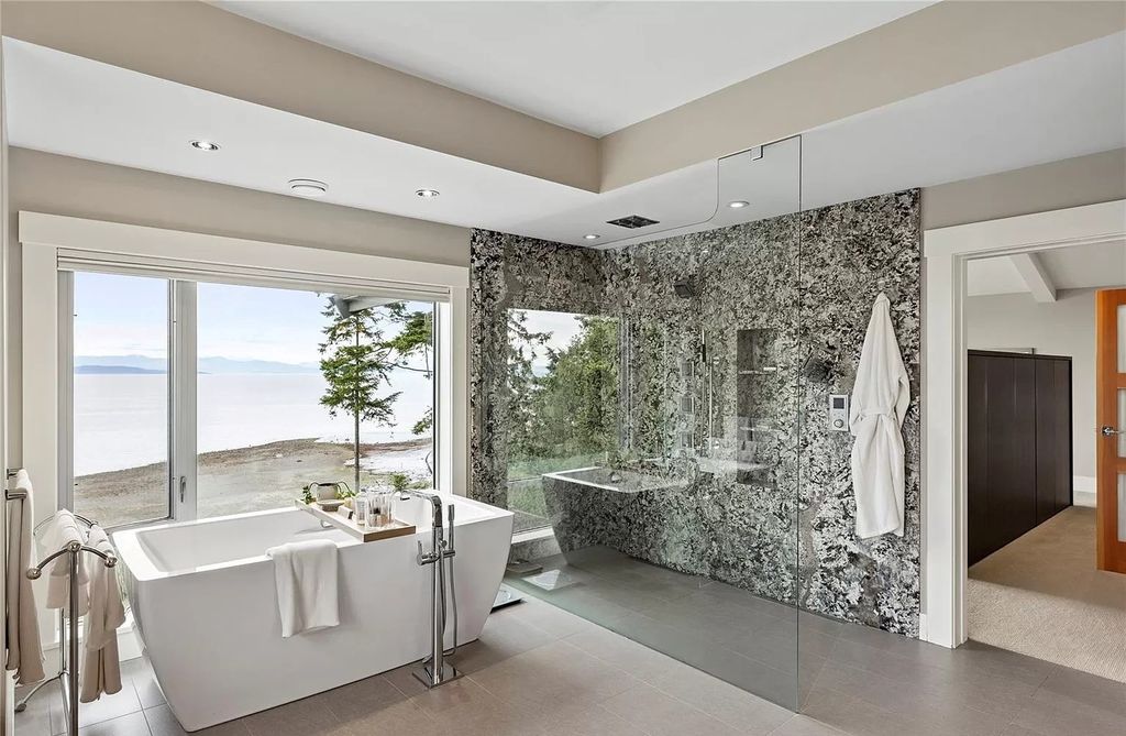 The Home in Parksville is majestically set on 0.64 of an acre with a private path that leads to the beach living space below, now available for sale. This home located at 798 Fairwind Ave, Parksville, BC V9P 1B2, Canada