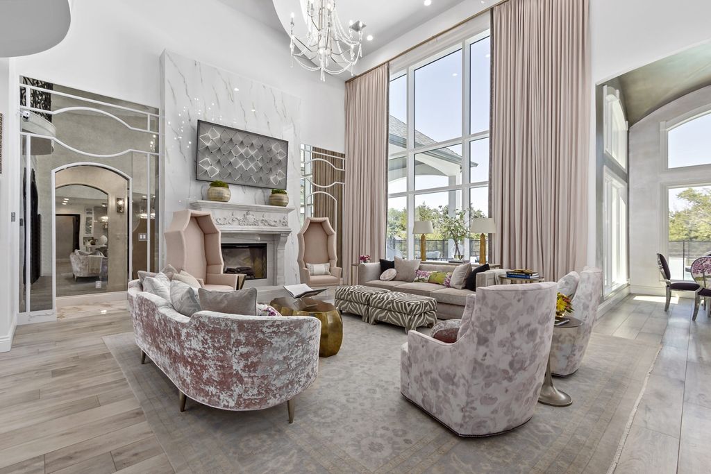 The Home in Bryan, a luxurious custom residence has a open concept great room complete with 20-foot ceilings, a beautifully designed pool and elegant outdoor entertaining area. This home located at 7163 Riverstone Dr, Bryan, Texas.