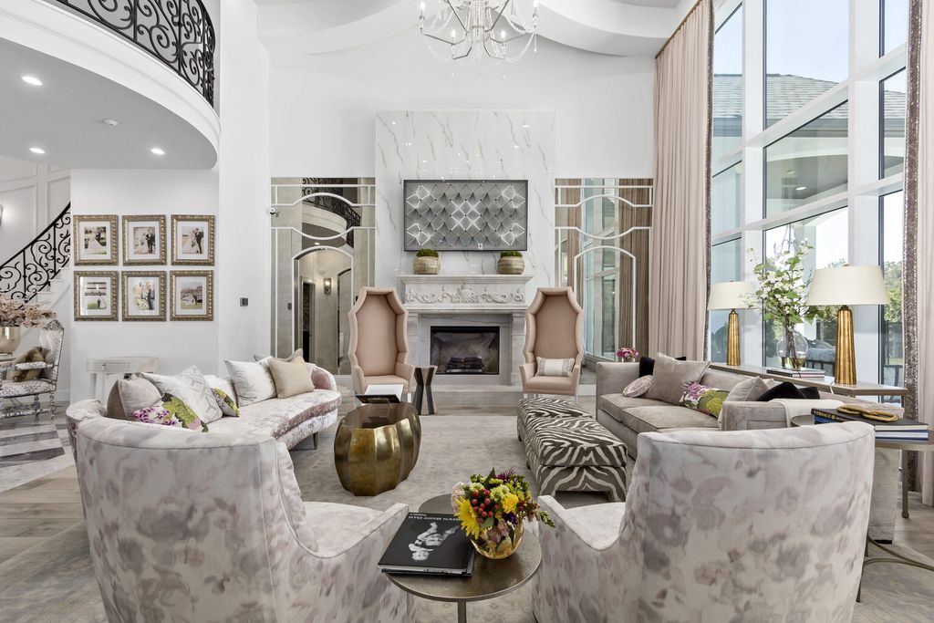The Home in Bryan, a luxurious custom residence has a open concept great room complete with 20-foot ceilings, a beautifully designed pool and elegant outdoor entertaining area. This home located at 7163 Riverstone Dr, Bryan, Texas.