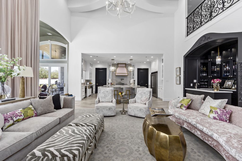 The Home in Bryan, a luxurious custom residence has a open concept great room complete with 20-foot ceilings, a beautifully designed pool and elegant outdoor entertaining area. This home located at 7163 Riverstone Dr, Bryan, Texas.