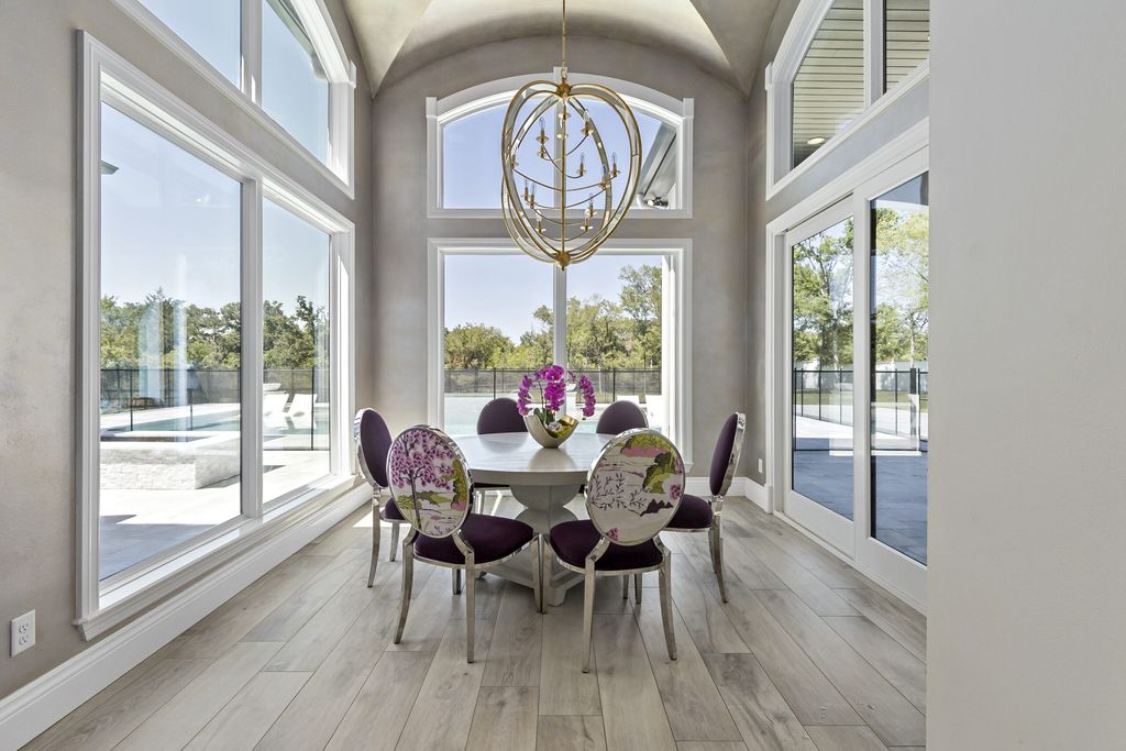 The Home in Bryan, a luxurious custom residence has a open concept great room complete with 20-foot ceilings, a beautifully designed pool and elegant outdoor entertaining area. This home located at 7163 Riverstone Dr, Bryan, Texas.