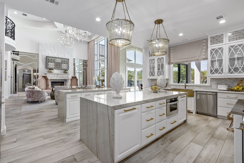 The Home in Bryan, a luxurious custom residence has a open concept great room complete with 20-foot ceilings, a beautifully designed pool and elegant outdoor entertaining area. This home located at 7163 Riverstone Dr, Bryan, Texas.