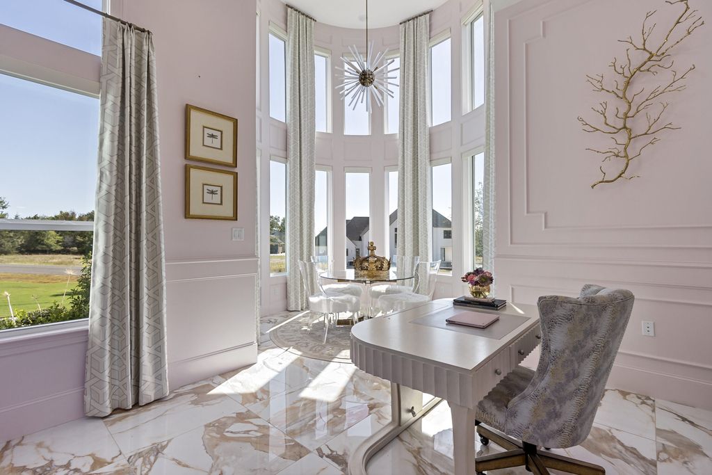 The Home in Bryan, a luxurious custom residence has a open concept great room complete with 20-foot ceilings, a beautifully designed pool and elegant outdoor entertaining area. This home located at 7163 Riverstone Dr, Bryan, Texas.