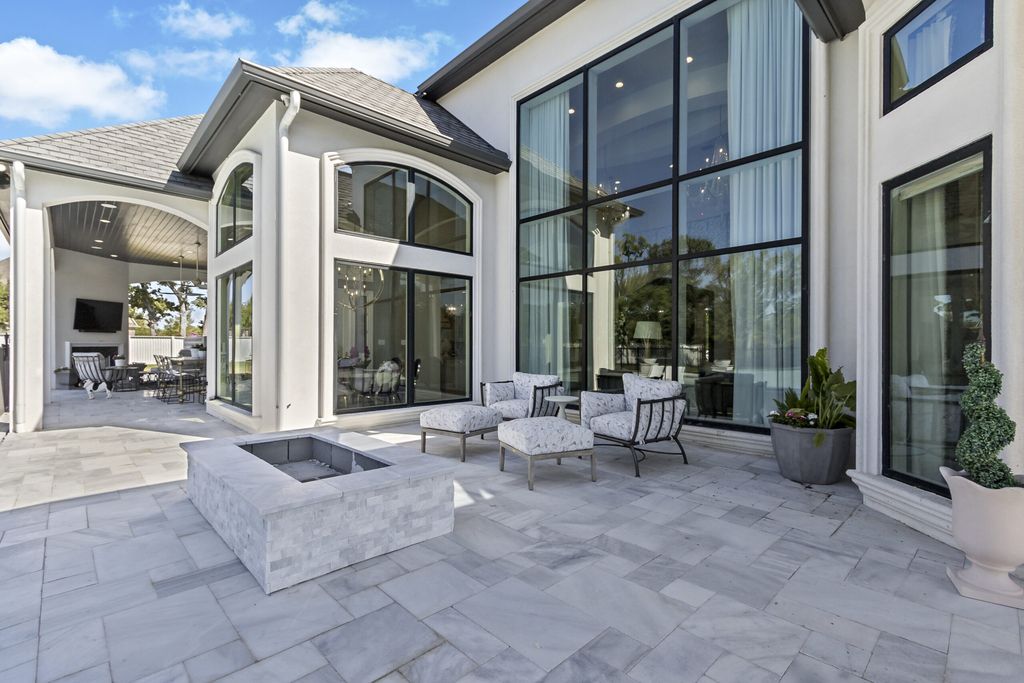 The Home in Bryan, a luxurious custom residence has a open concept great room complete with 20-foot ceilings, a beautifully designed pool and elegant outdoor entertaining area. This home located at 7163 Riverstone Dr, Bryan, Texas.