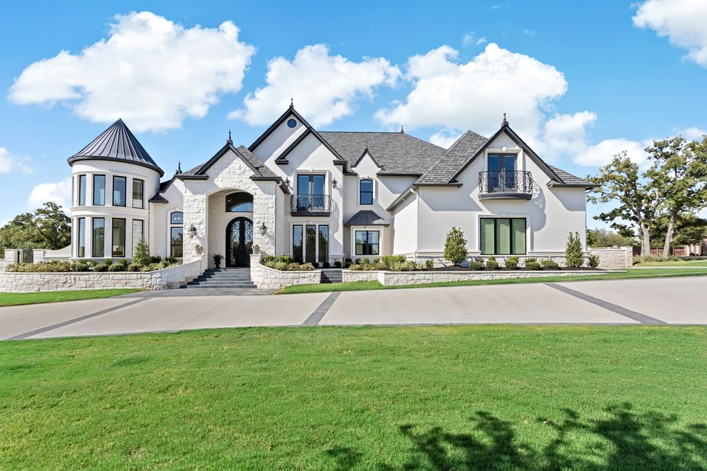 The Home in Bryan, a luxurious custom residence has a open concept great room complete with 20-foot ceilings, a beautifully designed pool and elegant outdoor entertaining area. This home located at 7163 Riverstone Dr, Bryan, Texas.