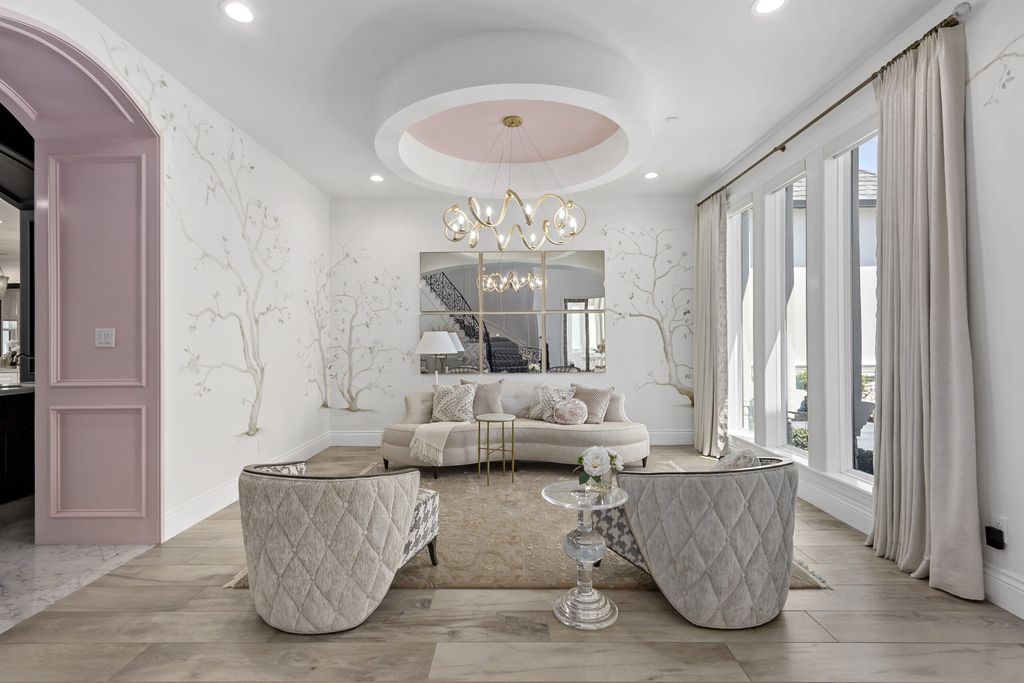 The Home in Bryan, a luxurious custom residence has a open concept great room complete with 20-foot ceilings, a beautifully designed pool and elegant outdoor entertaining area. This home located at 7163 Riverstone Dr, Bryan, Texas.