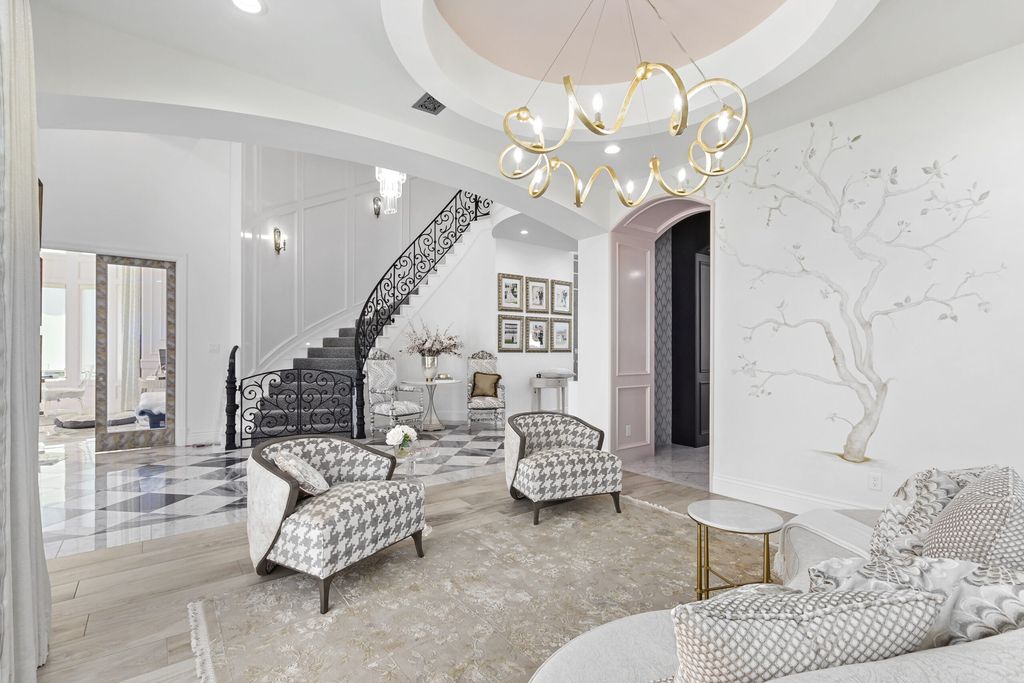 The Home in Bryan, a luxurious custom residence has a open concept great room complete with 20-foot ceilings, a beautifully designed pool and elegant outdoor entertaining area. This home located at 7163 Riverstone Dr, Bryan, Texas.