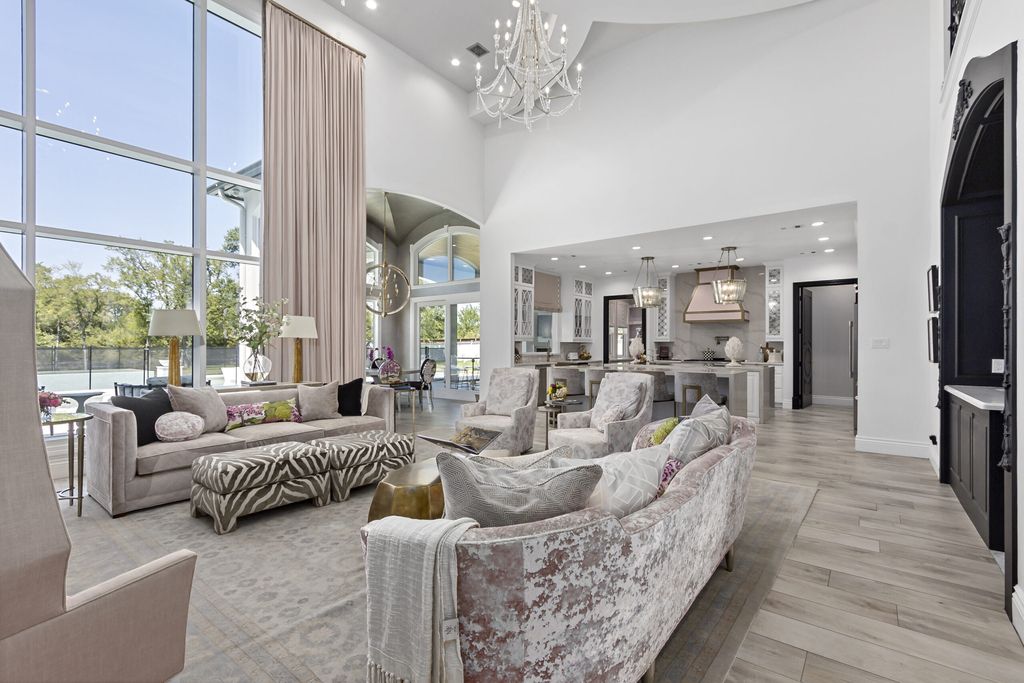 The Home in Bryan, a luxurious custom residence has a open concept great room complete with 20-foot ceilings, a beautifully designed pool and elegant outdoor entertaining area. This home located at 7163 Riverstone Dr, Bryan, Texas.