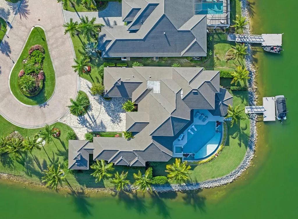The Home in Miromar Lakes, a magnificent estate on a private waterfront peninsula showcases exquisite architectural details and an amazing outdoor oasis is now available for sale. This home located at 11910 Via Salerno Way, Miromar Lakes, Florida
