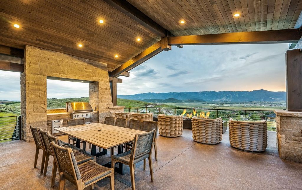 The Masterpiece in Park City, an amazing Upwall Design home showcases the stunning views, the majestic expanse of the main hallway, the seamless marriage of wood, stone and glass. This home located at 7400 Bugle Trl, Park City, Utah.