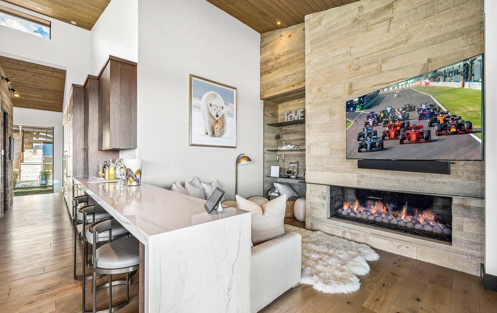 The Masterpiece in Park City, an amazing Upwall Design home showcases the stunning views, the majestic expanse of the main hallway, the seamless marriage of wood, stone and glass. This home located at 7400 Bugle Trl, Park City, Utah.