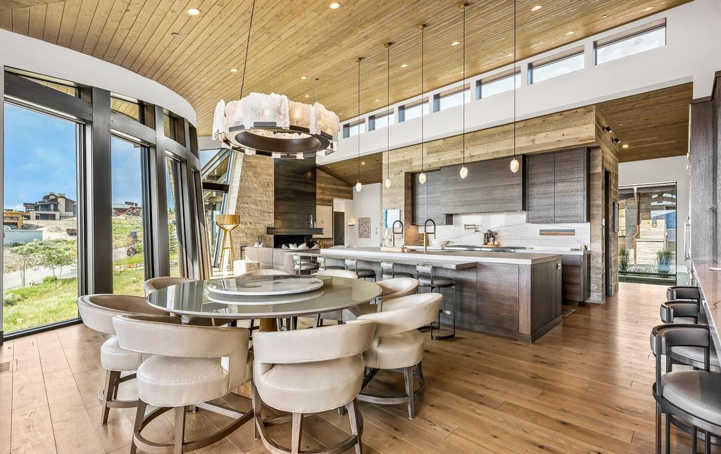 The Masterpiece in Park City, an amazing Upwall Design home showcases the stunning views, the majestic expanse of the main hallway, the seamless marriage of wood, stone and glass. This home located at 7400 Bugle Trl, Park City, Utah.