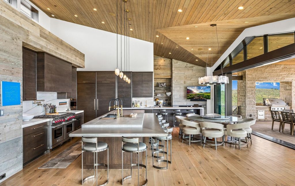 The Masterpiece in Park City, an amazing Upwall Design home showcases the stunning views, the majestic expanse of the main hallway, the seamless marriage of wood, stone and glass. This home located at 7400 Bugle Trl, Park City, Utah.