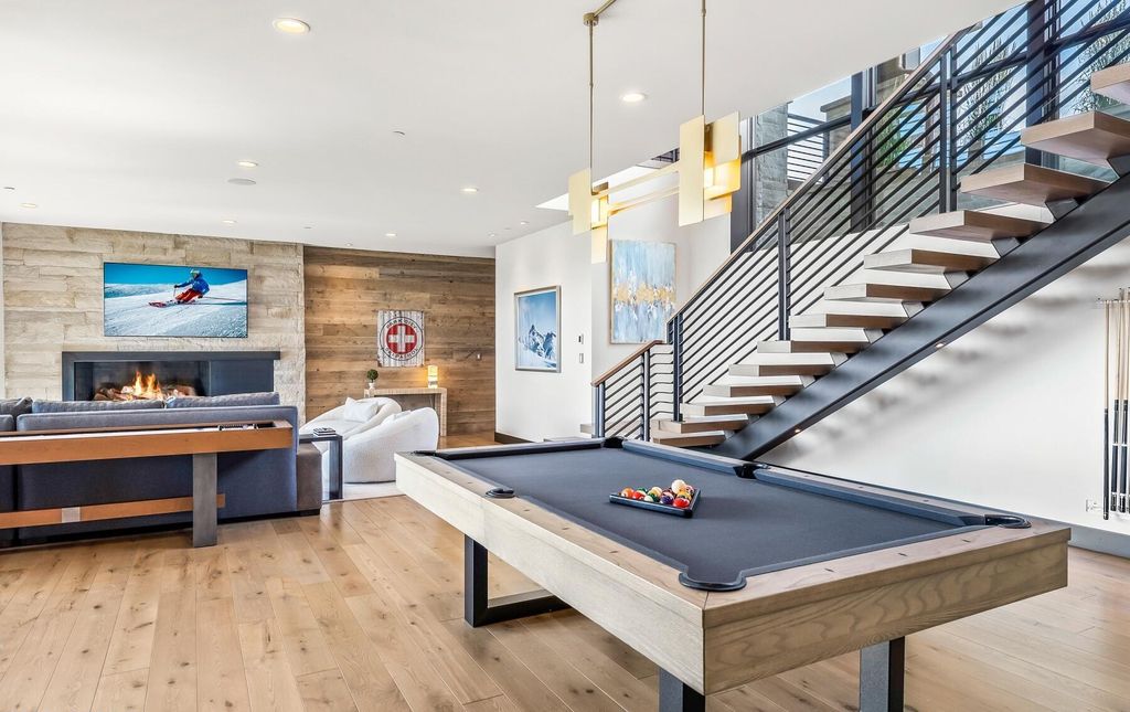 The Masterpiece in Park City, an amazing Upwall Design home showcases the stunning views, the majestic expanse of the main hallway, the seamless marriage of wood, stone and glass. This home located at 7400 Bugle Trl, Park City, Utah.