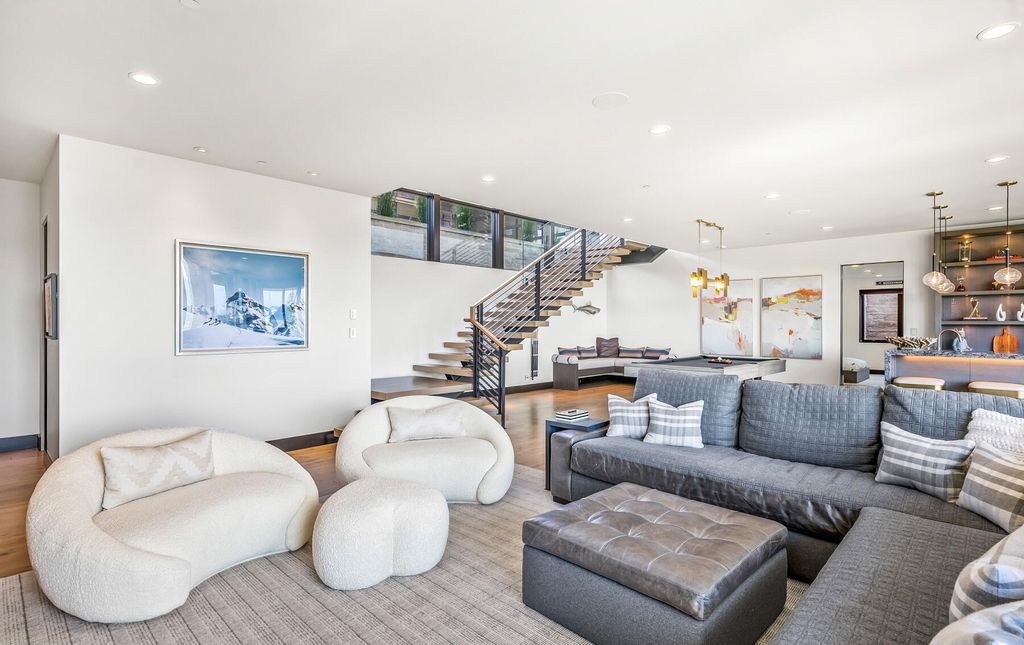 The Masterpiece in Park City, an amazing Upwall Design home showcases the stunning views, the majestic expanse of the main hallway, the seamless marriage of wood, stone and glass. This home located at 7400 Bugle Trl, Park City, Utah.