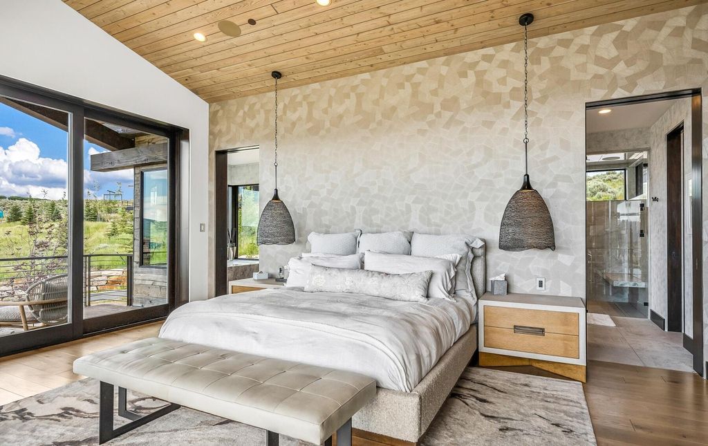 The Masterpiece in Park City, an amazing Upwall Design home showcases the stunning views, the majestic expanse of the main hallway, the seamless marriage of wood, stone and glass. This home located at 7400 Bugle Trl, Park City, Utah.