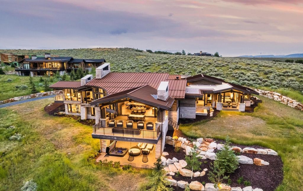 The Masterpiece in Park City, an amazing Upwall Design home showcases the stunning views, the majestic expanse of the main hallway, the seamless marriage of wood, stone and glass. This home located at 7400 Bugle Trl, Park City, Utah.