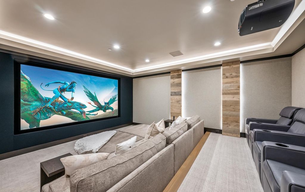 The Masterpiece in Park City, an amazing Upwall Design home showcases the stunning views, the majestic expanse of the main hallway, the seamless marriage of wood, stone and glass. This home located at 7400 Bugle Trl, Park City, Utah.