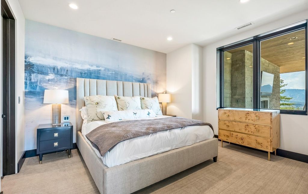 The Masterpiece in Park City, an amazing Upwall Design home showcases the stunning views, the majestic expanse of the main hallway, the seamless marriage of wood, stone and glass. This home located at 7400 Bugle Trl, Park City, Utah.