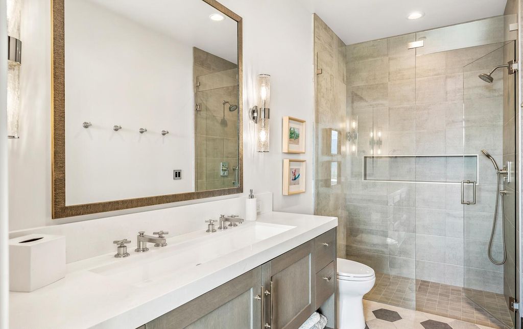 The Masterpiece in Park City, an amazing Upwall Design home showcases the stunning views, the majestic expanse of the main hallway, the seamless marriage of wood, stone and glass. This home located at 7400 Bugle Trl, Park City, Utah.