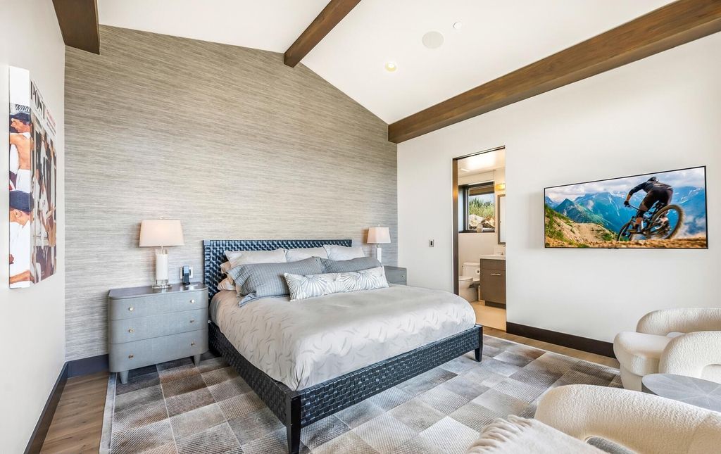 The Masterpiece in Park City, an amazing Upwall Design home showcases the stunning views, the majestic expanse of the main hallway, the seamless marriage of wood, stone and glass. This home located at 7400 Bugle Trl, Park City, Utah.