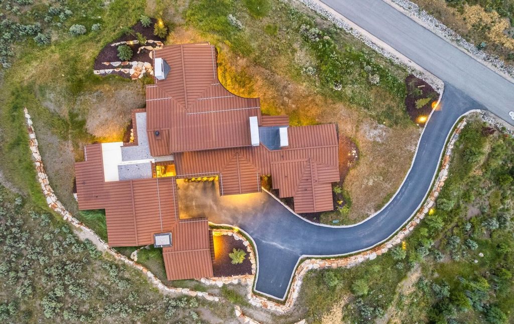 The Masterpiece in Park City, an amazing Upwall Design home showcases the stunning views, the majestic expanse of the main hallway, the seamless marriage of wood, stone and glass. This home located at 7400 Bugle Trl, Park City, Utah.
