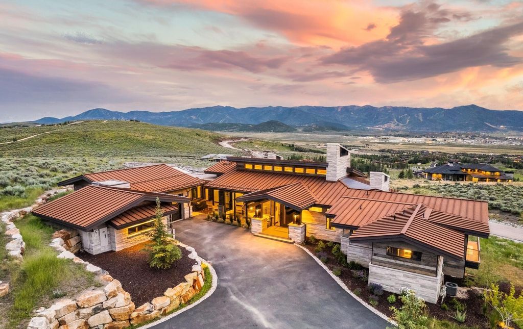 The Masterpiece in Park City, an amazing Upwall Design home showcases the stunning views, the majestic expanse of the main hallway, the seamless marriage of wood, stone and glass. This home located at 7400 Bugle Trl, Park City, Utah.