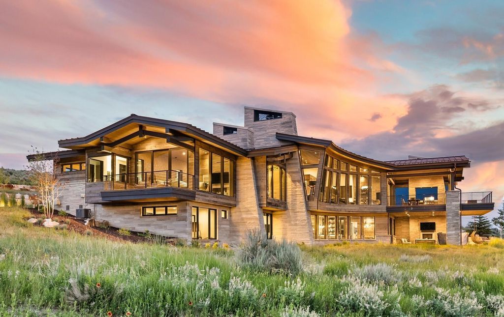The Masterpiece in Park City, an amazing Upwall Design home showcases the stunning views, the majestic expanse of the main hallway, the seamless marriage of wood, stone and glass. This home located at 7400 Bugle Trl, Park City, Utah.