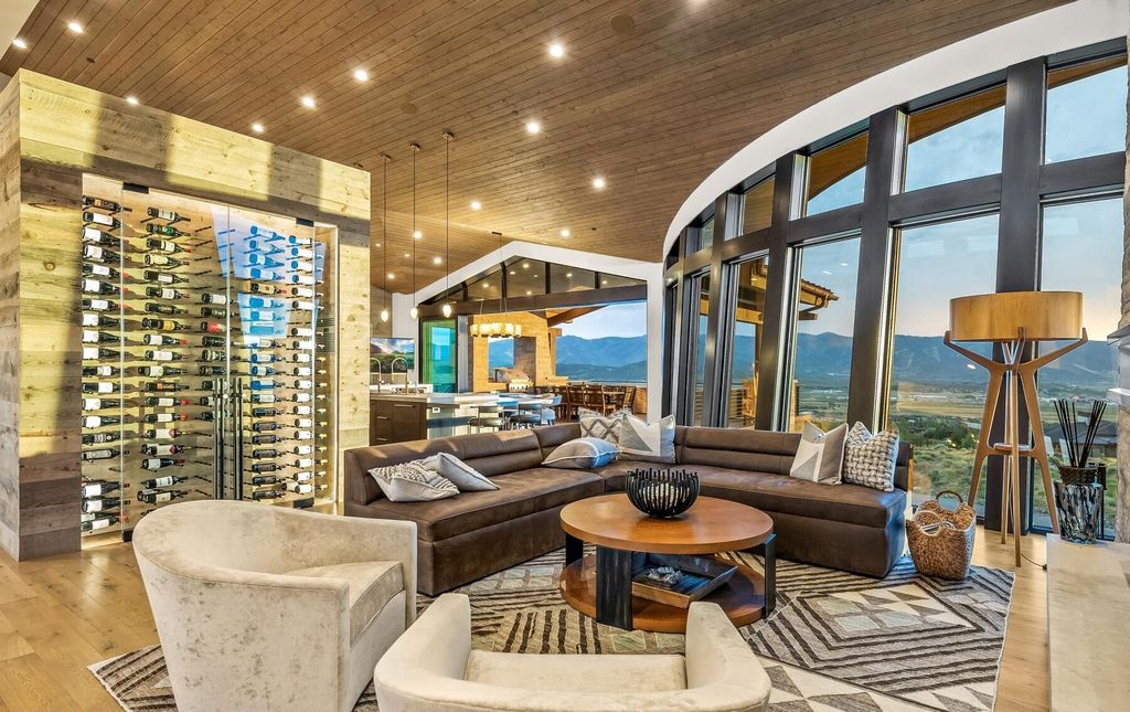 The Masterpiece in Park City, an amazing Upwall Design home showcases the stunning views, the majestic expanse of the main hallway, the seamless marriage of wood, stone and glass. This home located at 7400 Bugle Trl, Park City, Utah.