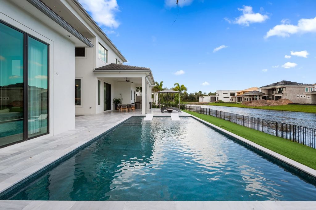 The Home in Boca Raton, the most exceptional home in Royal Palm Polo features luxurious wall coverings, custom built-ins and exquisite lighting is now available for sale. This home located at 7405 NW 27th Ave, Boca Raton, Florida