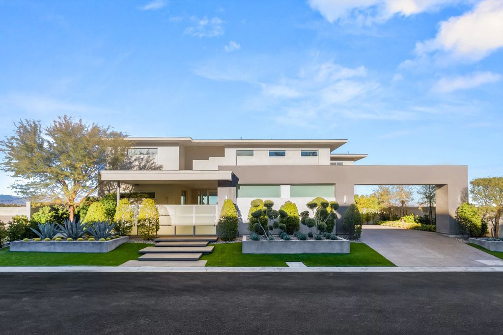 The Masterpiece in Las Vegas, a stunning contemporary home majestically perched within the prestigious guard-gated Spanish Hills offering some of the best Las Vegas Strip views. This home located at 5198 Scenic Ridge Dr, Las Vegas, Nevada.