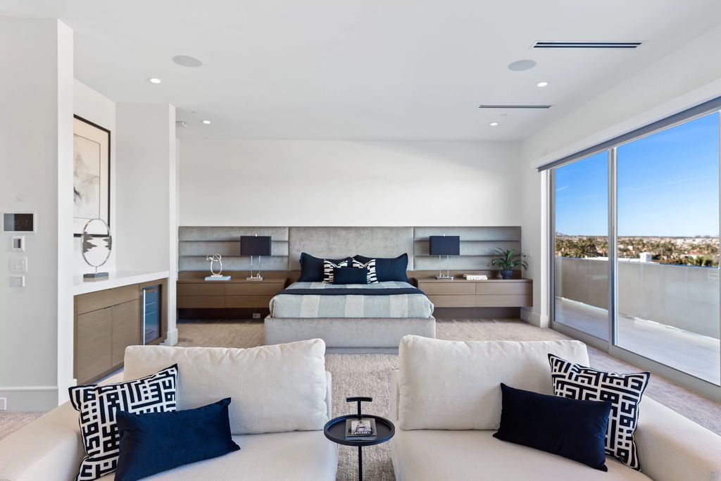 The Masterpiece in Las Vegas, a stunning contemporary home majestically perched within the prestigious guard-gated Spanish Hills offering some of the best Las Vegas Strip views. This home located at 5198 Scenic Ridge Dr, Las Vegas, Nevada.