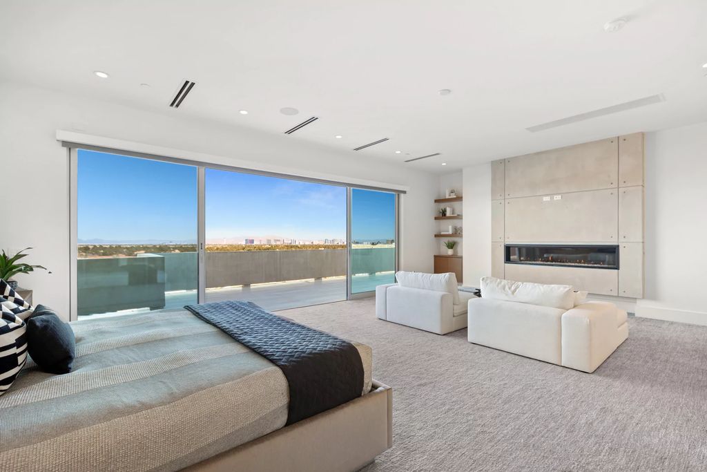 The Masterpiece in Las Vegas, a stunning contemporary home majestically perched within the prestigious guard-gated Spanish Hills offering some of the best Las Vegas Strip views. This home located at 5198 Scenic Ridge Dr, Las Vegas, Nevada.