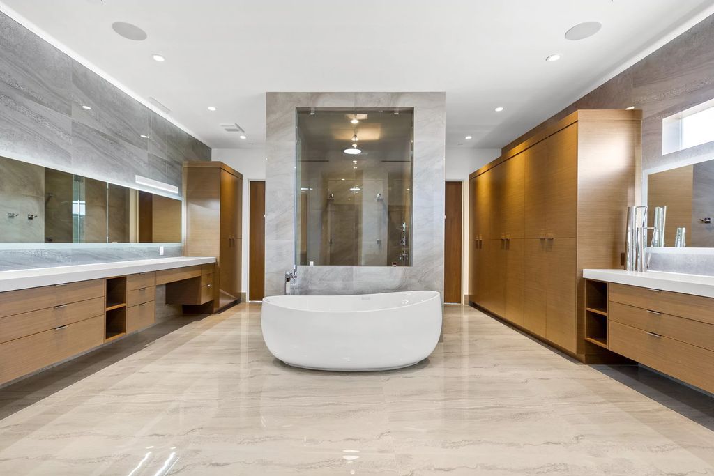 The Masterpiece in Las Vegas, a stunning contemporary home majestically perched within the prestigious guard-gated Spanish Hills offering some of the best Las Vegas Strip views. This home located at 5198 Scenic Ridge Dr, Las Vegas, Nevada.
