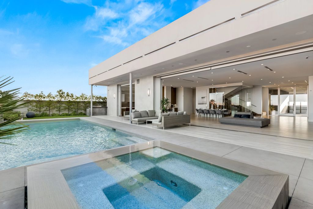 The Masterpiece in Las Vegas, a stunning contemporary home majestically perched within the prestigious guard-gated Spanish Hills offering some of the best Las Vegas Strip views. This home located at 5198 Scenic Ridge Dr, Las Vegas, Nevada.