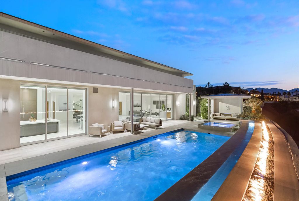 The Masterpiece in Las Vegas, a stunning contemporary home majestically perched within the prestigious guard-gated Spanish Hills offering some of the best Las Vegas Strip views. This home located at 5198 Scenic Ridge Dr, Las Vegas, Nevada.