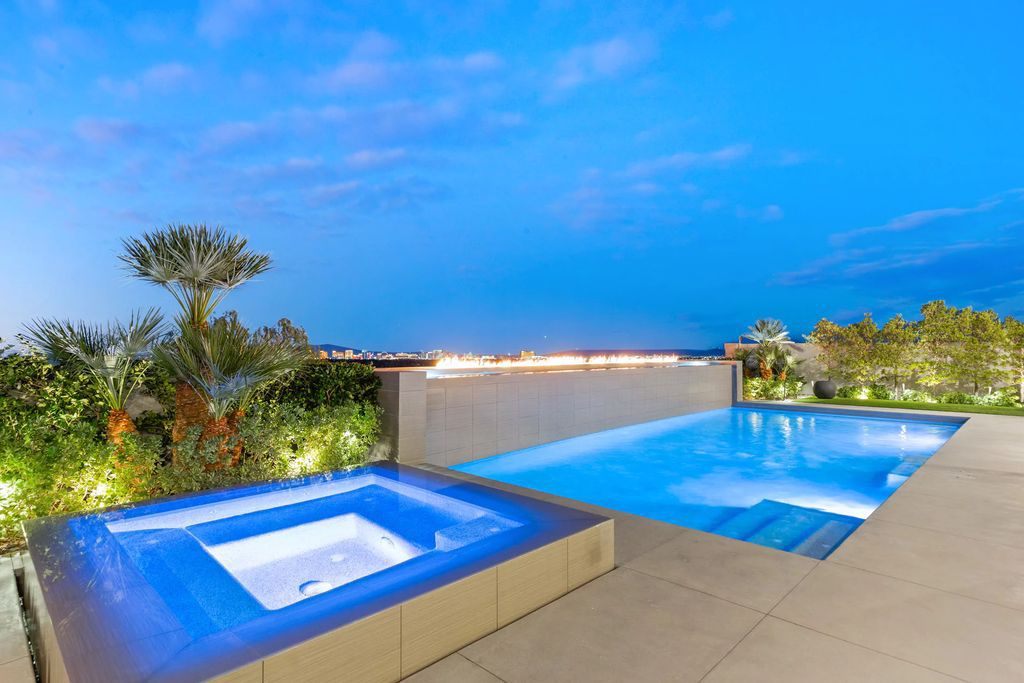 The Masterpiece in Las Vegas, a stunning contemporary home majestically perched within the prestigious guard-gated Spanish Hills offering some of the best Las Vegas Strip views. This home located at 5198 Scenic Ridge Dr, Las Vegas, Nevada.